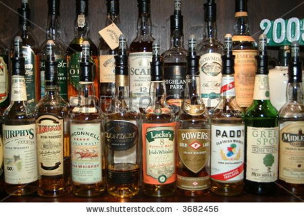 stock photo : a lot of different bottles of whiskey