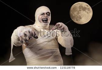 stock photo : Scary Halloween Mummy in the mist. Young men in mummy costume